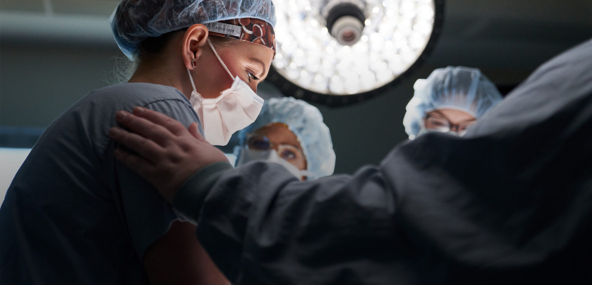 surgeons around operating table