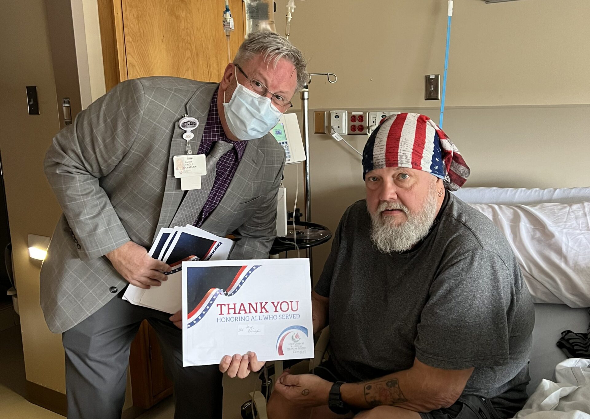 Chaplain Randy Tingle smiles with Chris King a veteran patient