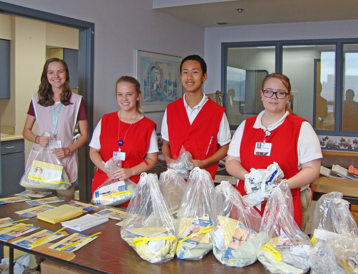 Jr-Vols-making-falls-prevention-kits-FINAL From left, Katie Starnes, Ryann Whitson, Henry Shen and Katie Law assemble falls-prevention packets used for patient care. They are just a few of the 45 Junior Volunteers who have taken time from their summer vacations to serve at Methodist Medical Center.
