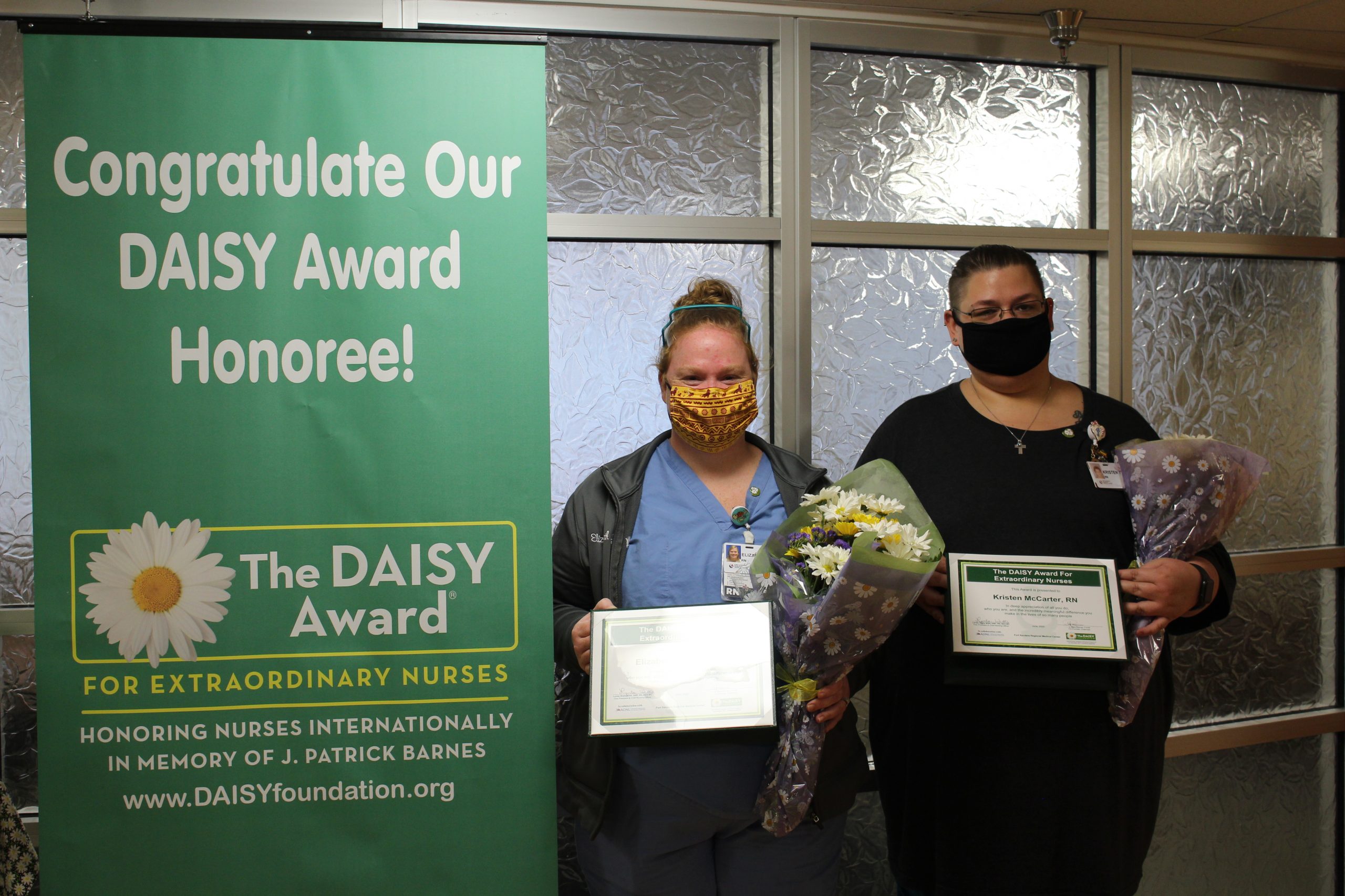 Elizabeth Cannon and Kristen McCarter receiving their DAISY awards.