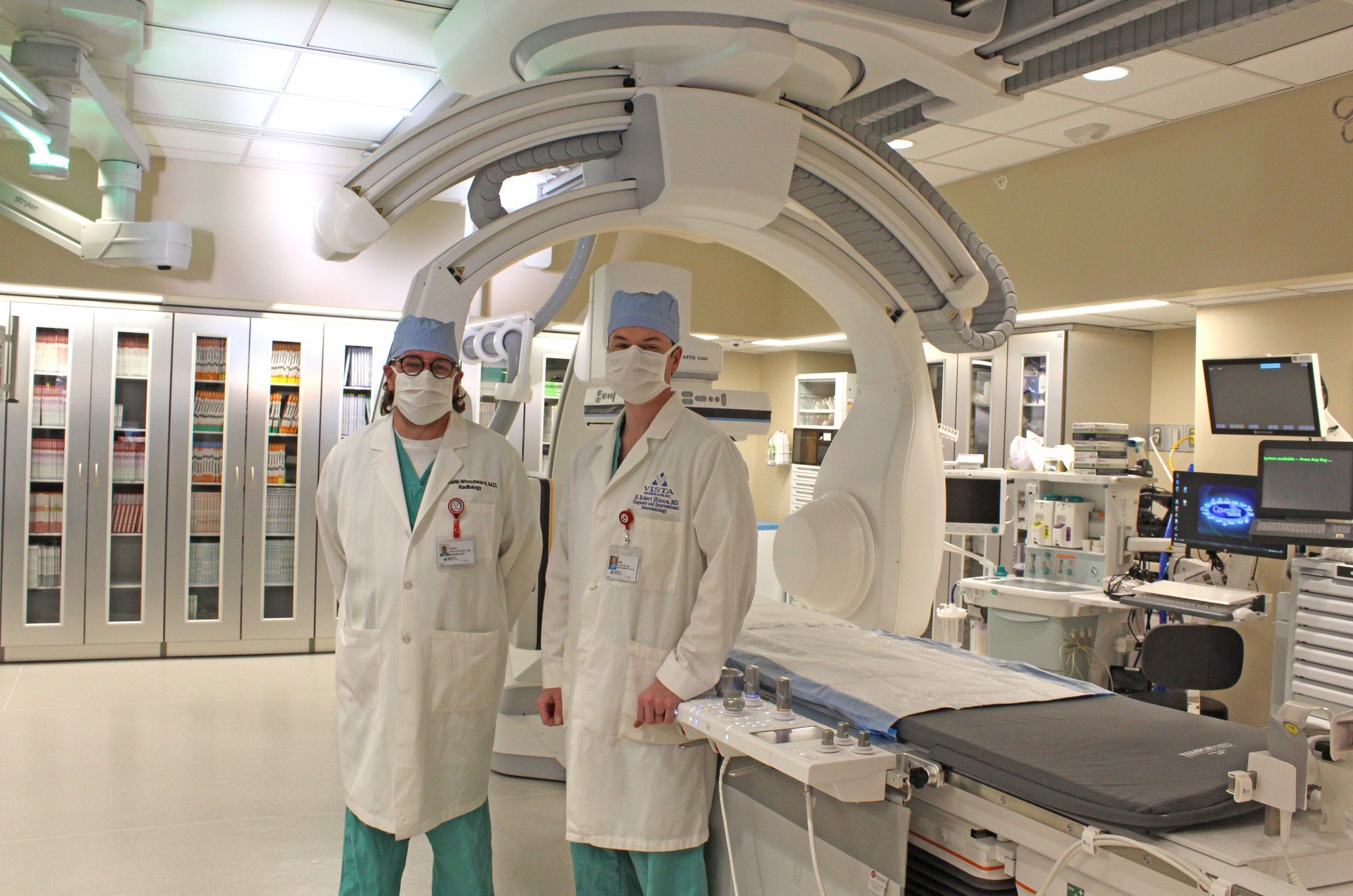 Dr. Woodward and Dr. Hixson with the new biplane imaging equipment