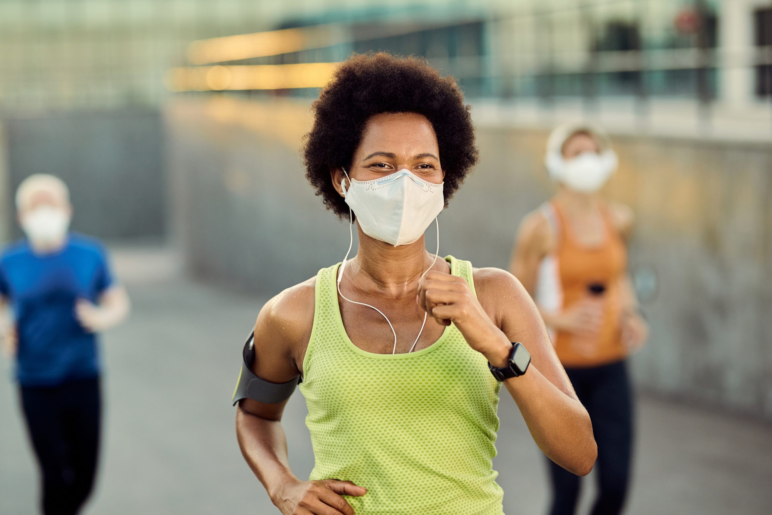 woman running with mask on