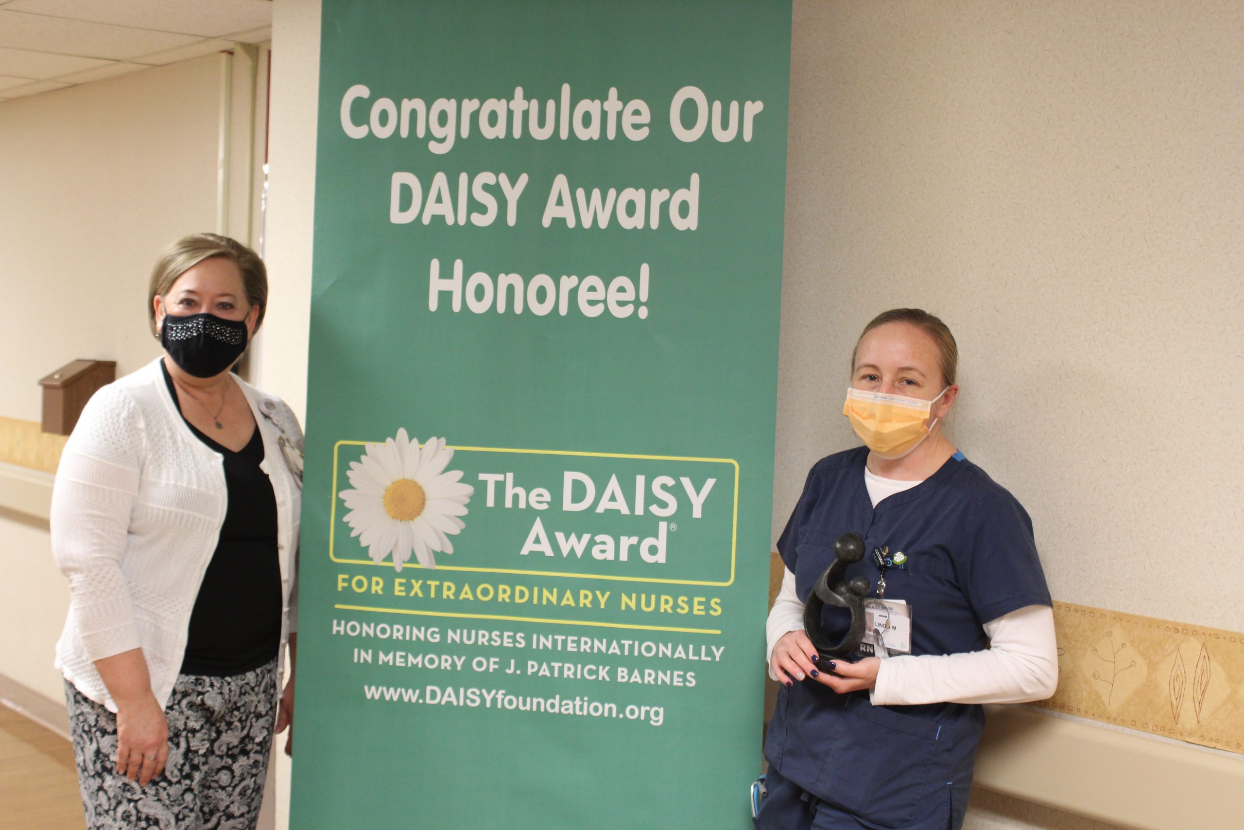 Linda McGinnis receiving her DAISY award