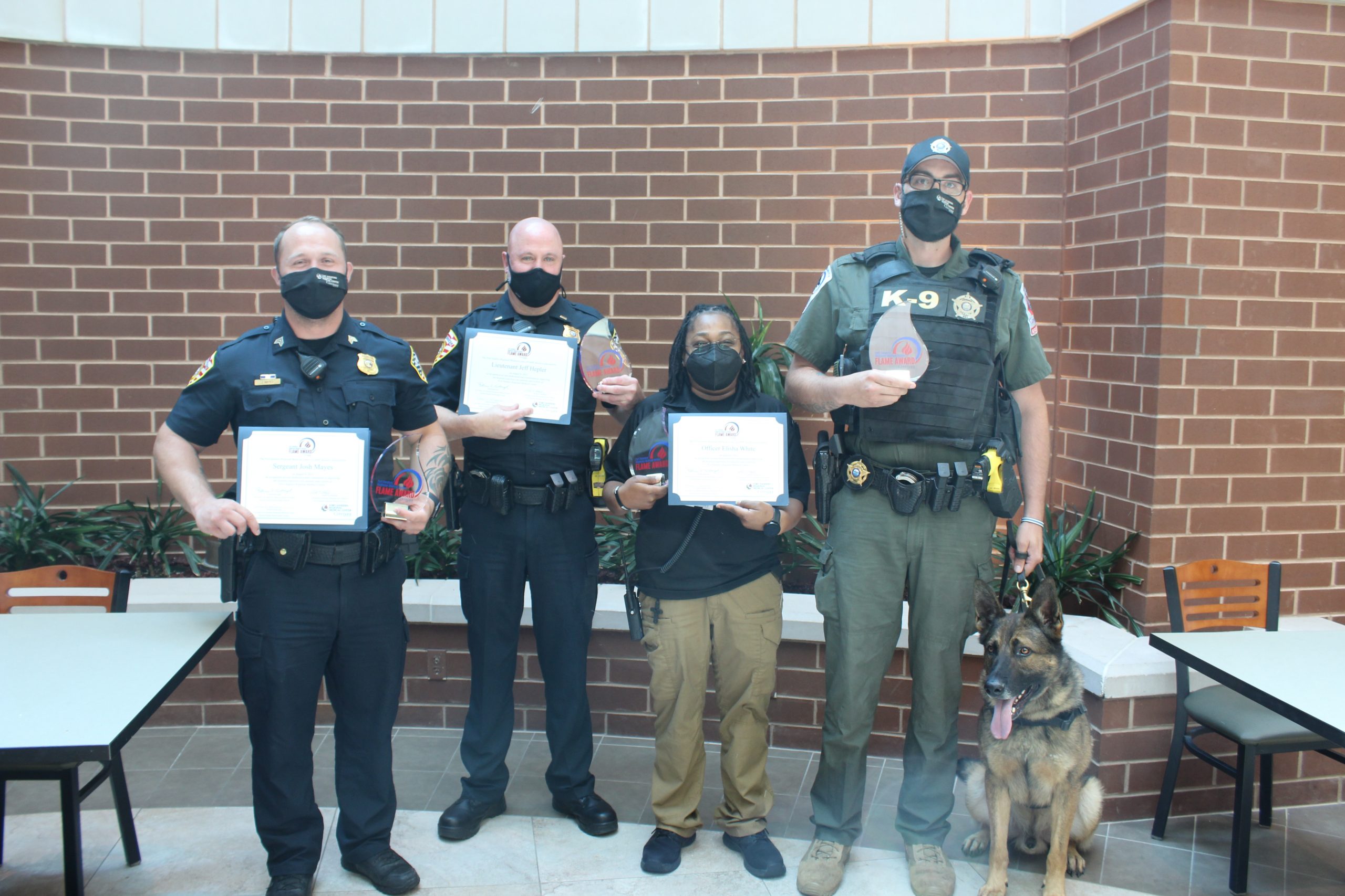 Security team receiving their FLAME awards