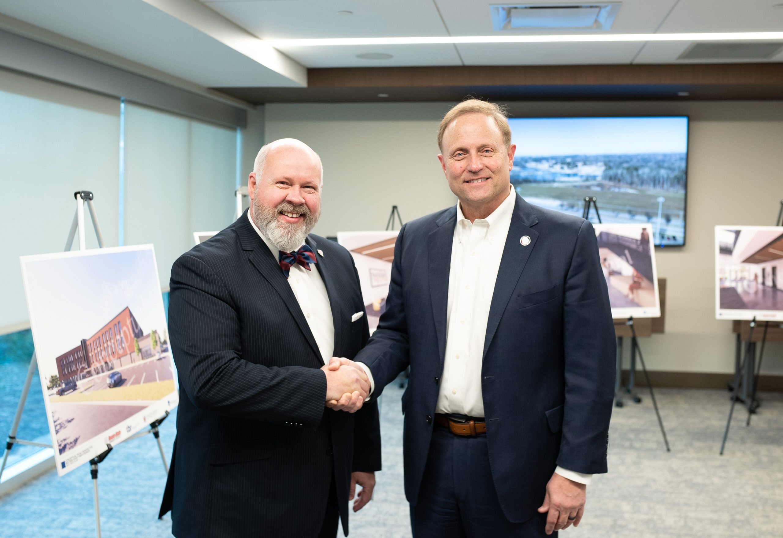 Whaley and VanderSteeg at RSCC Announcement Event Dr. Chris Whaley shakes hands with Jim VanderSteeg at the donation event