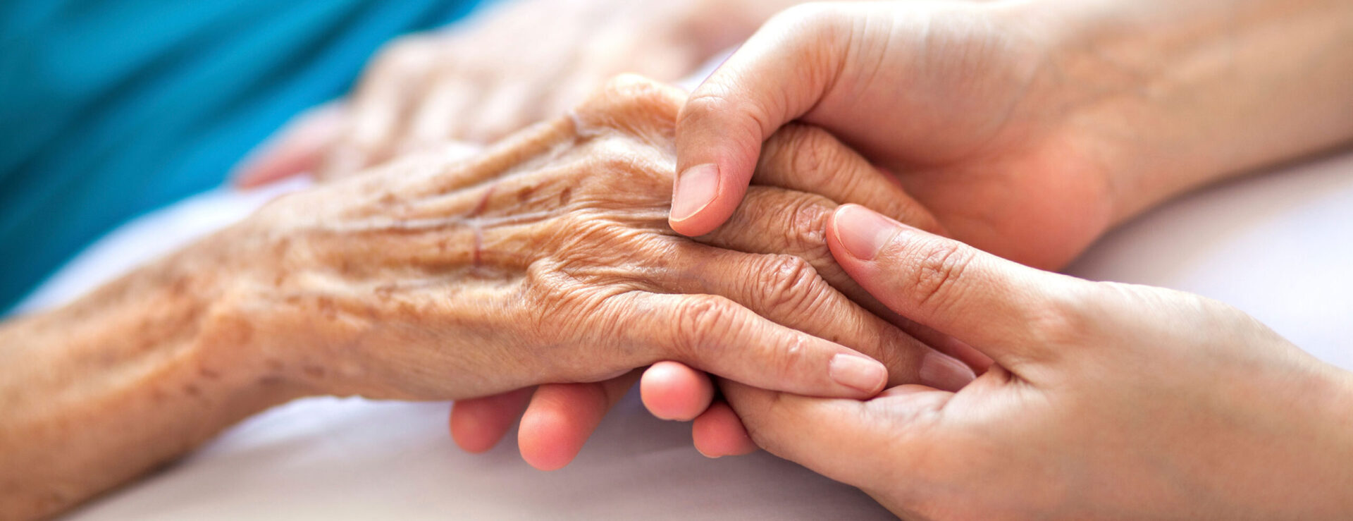 Hand holding of a geriatric patient.