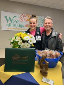 CMC Nurse Kellie Tucker proudly stands with past patient Brian Jones Kellie Tucker receives DAISY Award