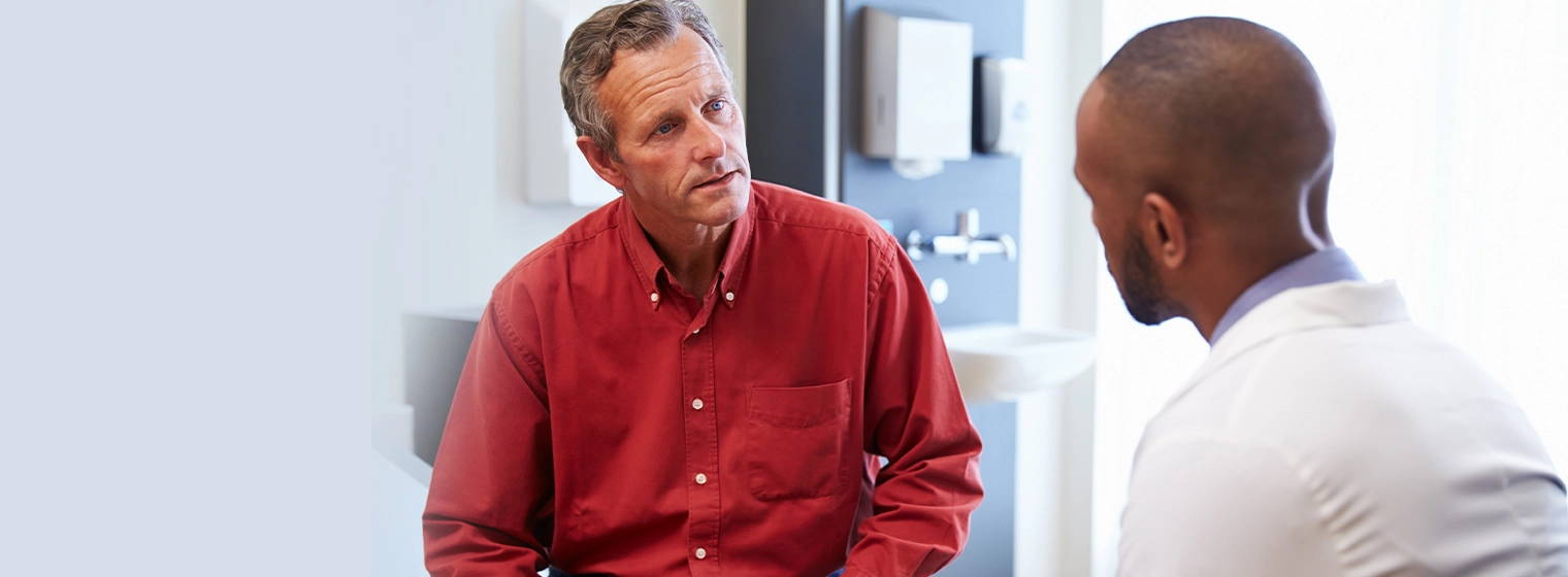 adult male patient speaking with provider