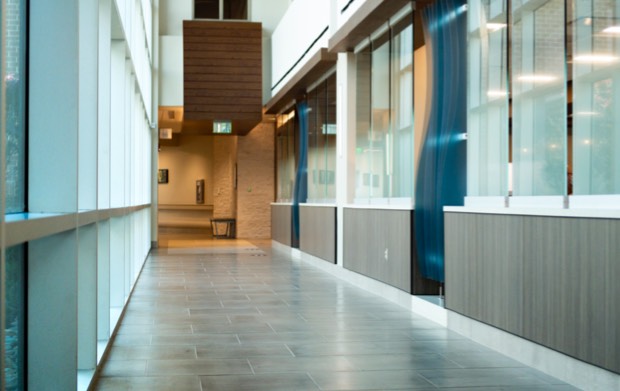 A long hallway with glass windows