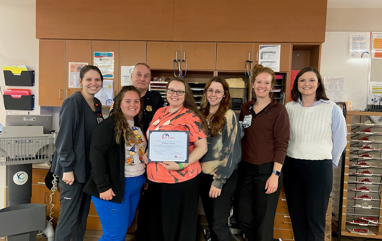 Group of nurses holding award