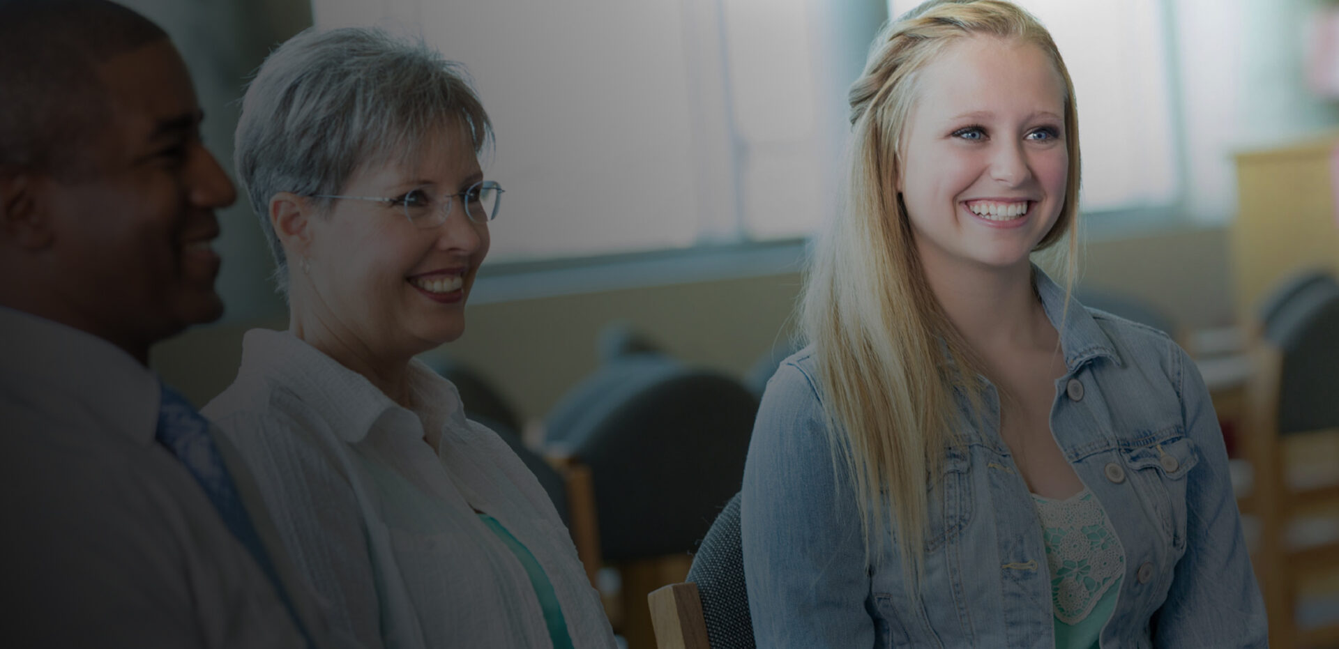 3 patients smiling in the waiting room