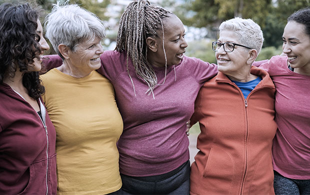 a group of older woman pose for a photo