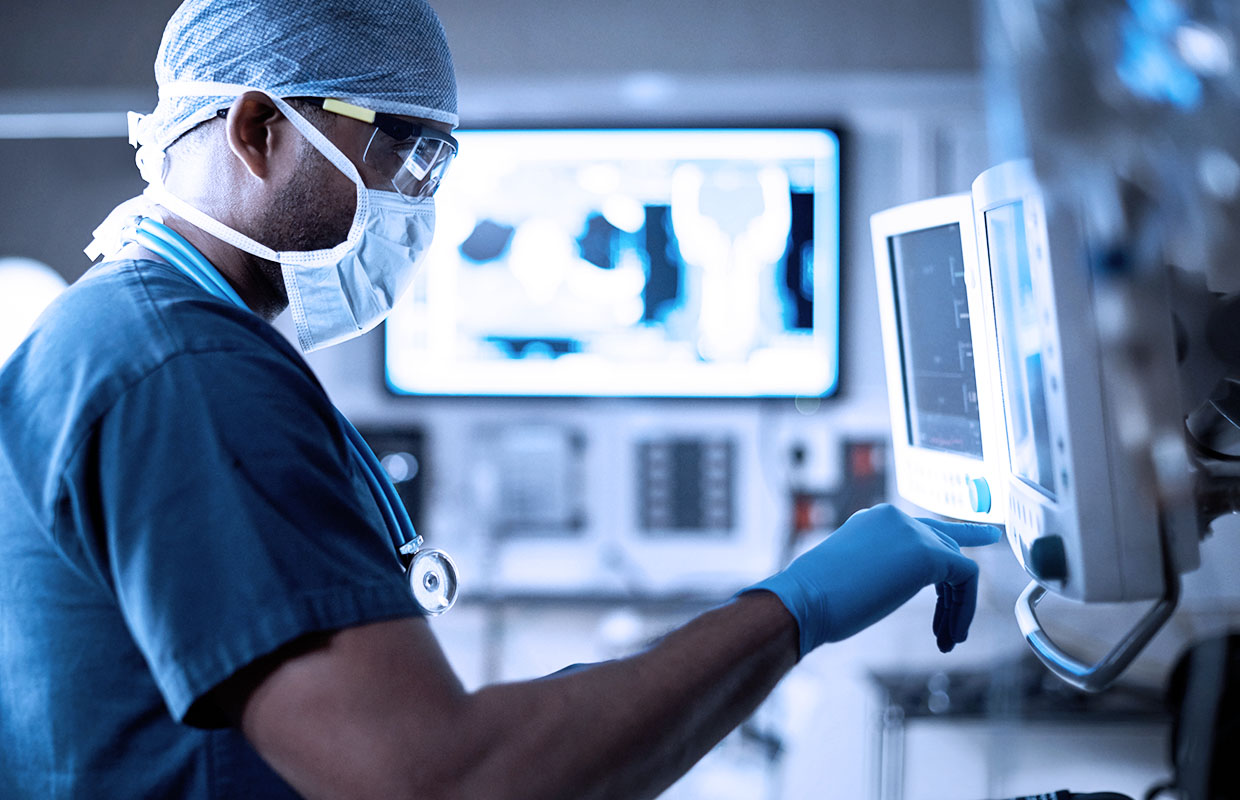 A doctor examining a screen from a patient's results