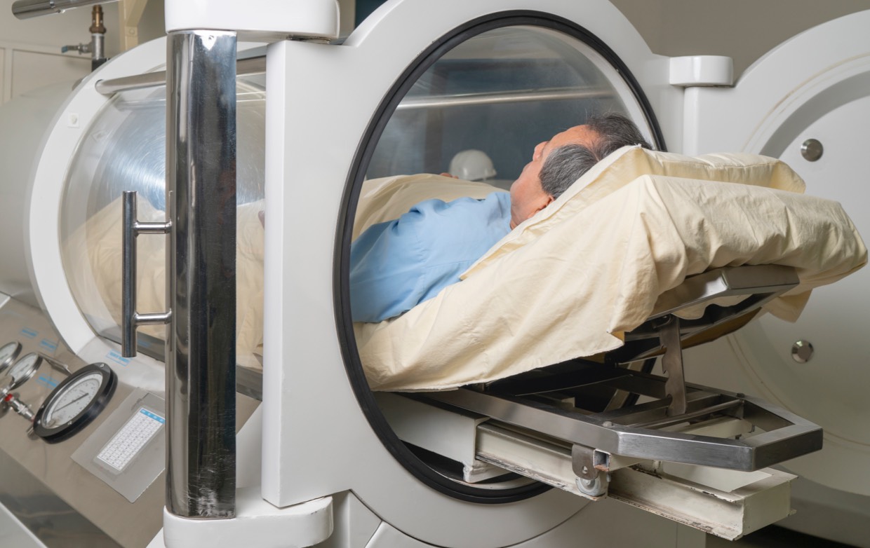 elderly male patient in a hyperbaric chamber