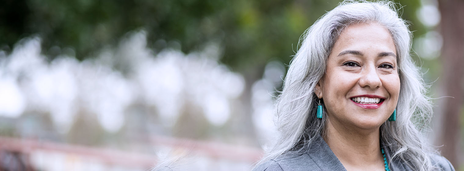smiling mature woman with long gray hair