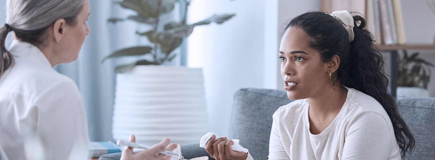 young female talking to female therapist