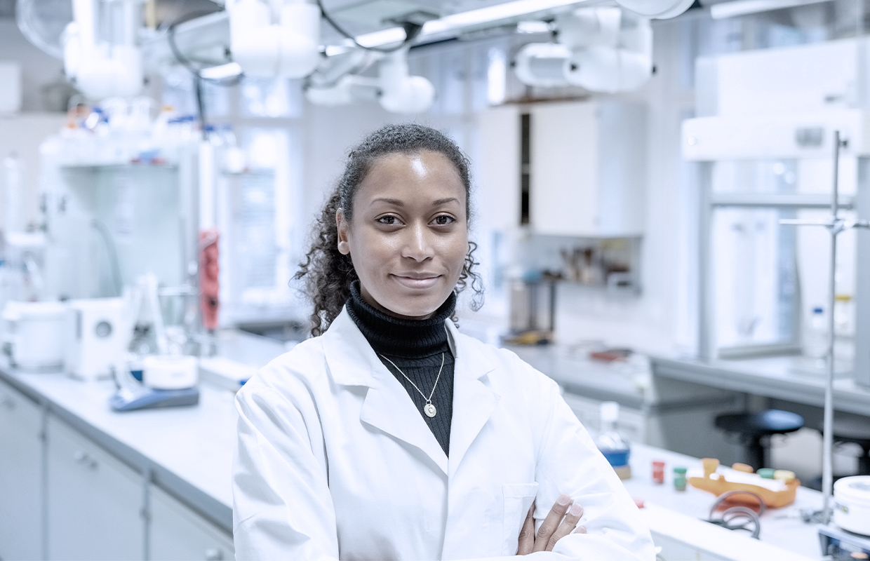 young female lab tech smiling in a laboratory