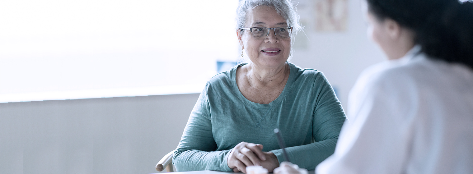 Female patient talks to a physician about lymphedema.