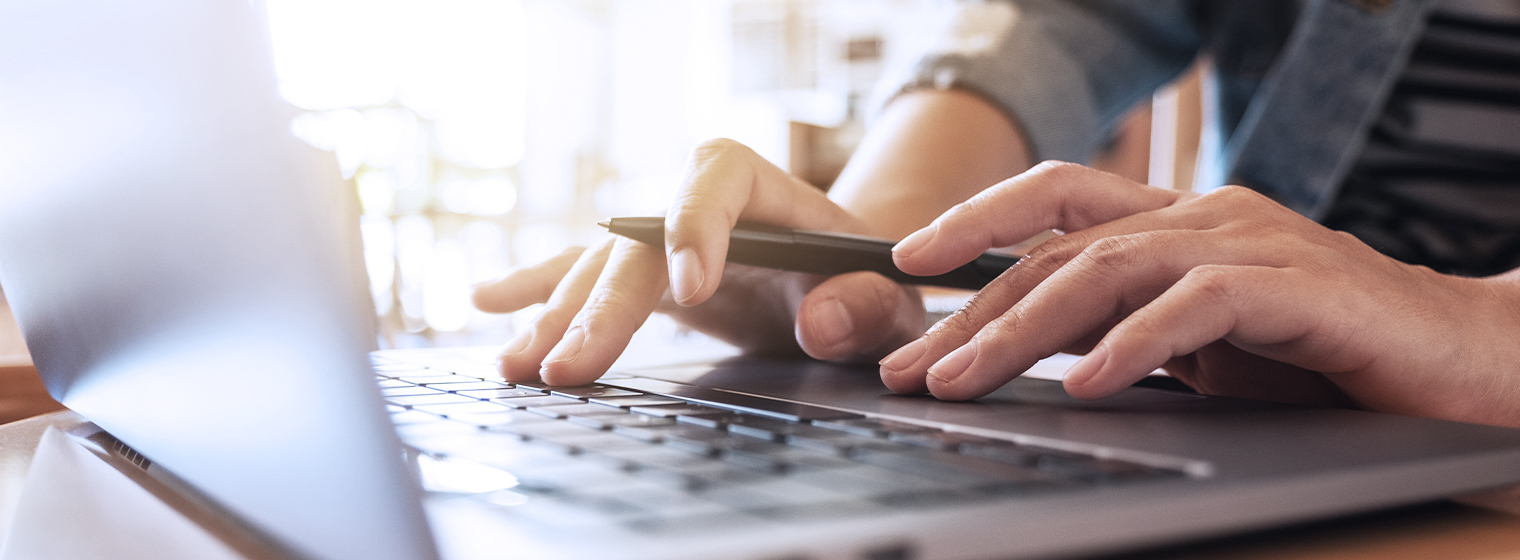 patient typing on computer keyboard to access online health record