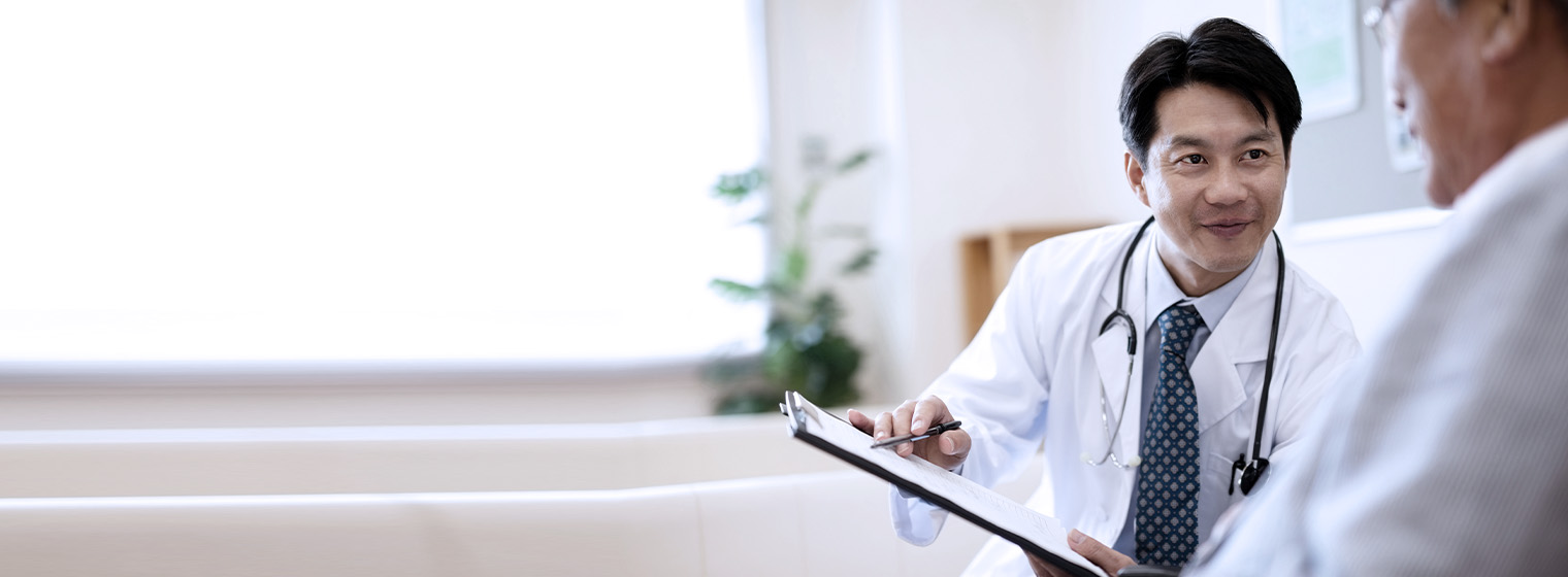 young doctor showing results to a patient