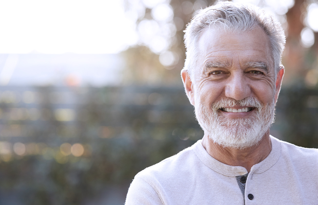 smiling elderly man outside