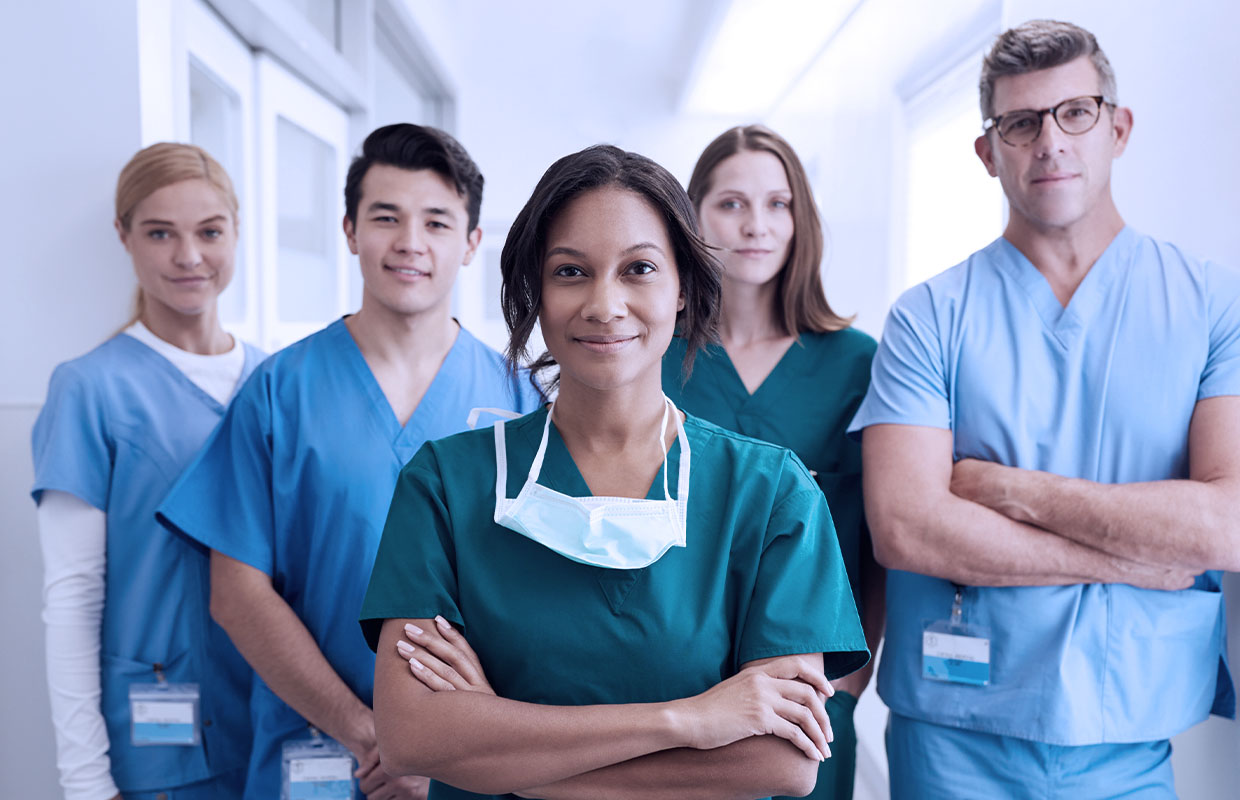 group of young nurses posing triumphantly