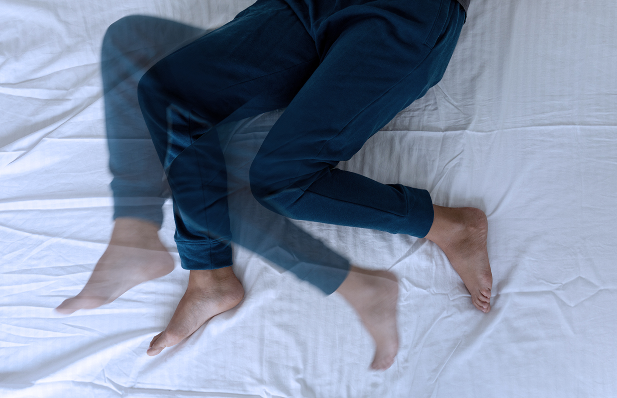 pair of legs in bed with second set to demonstrate moving