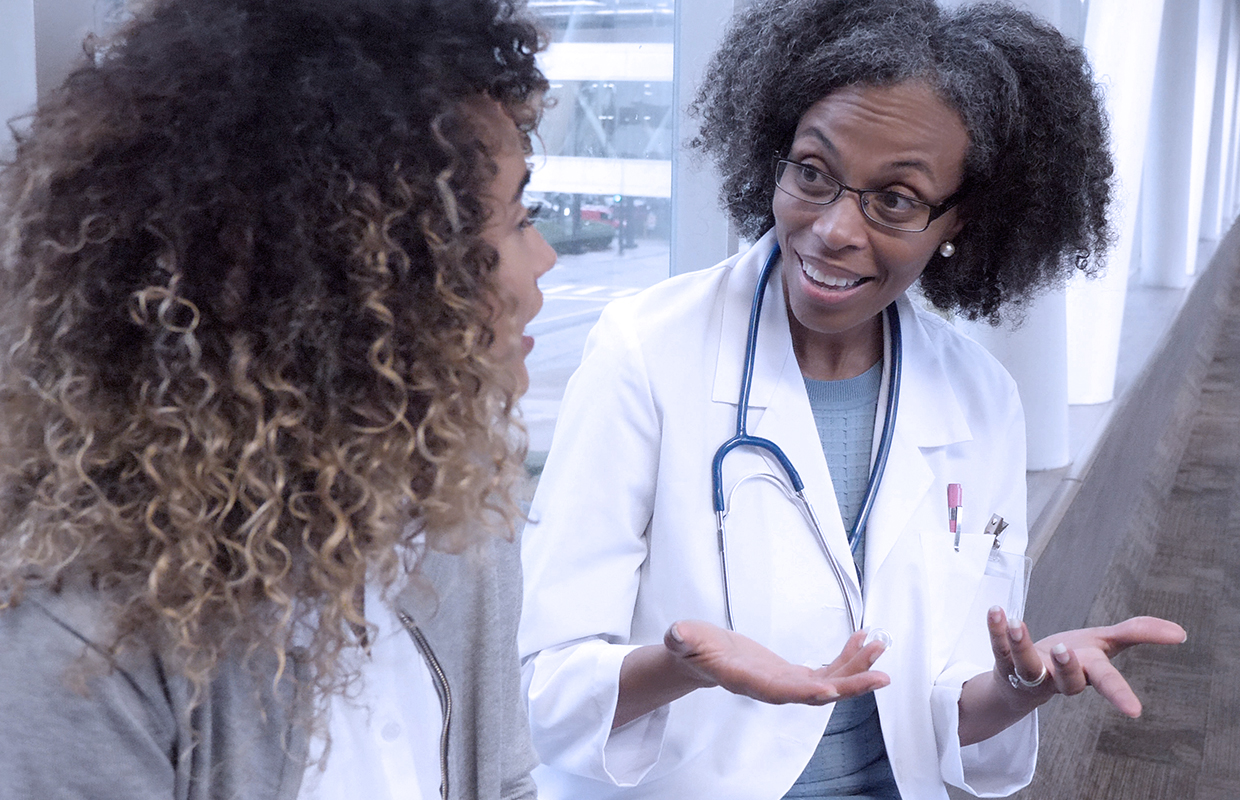 female doctor explaining something to a female patient