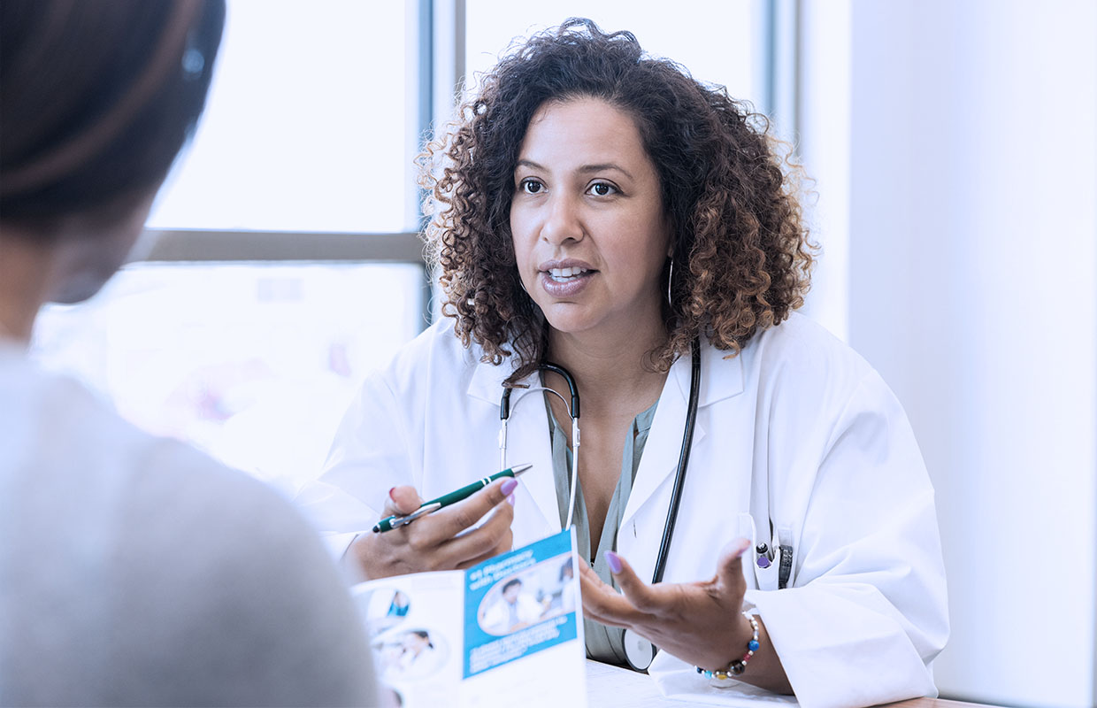 young female doctor talking to patient