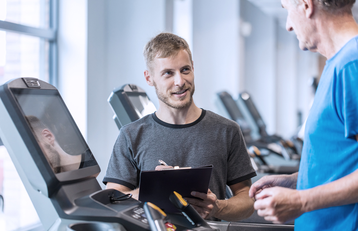 Male in his 60s jogs on a treadmill as part of his cardiopulmonary rehabilitation program.