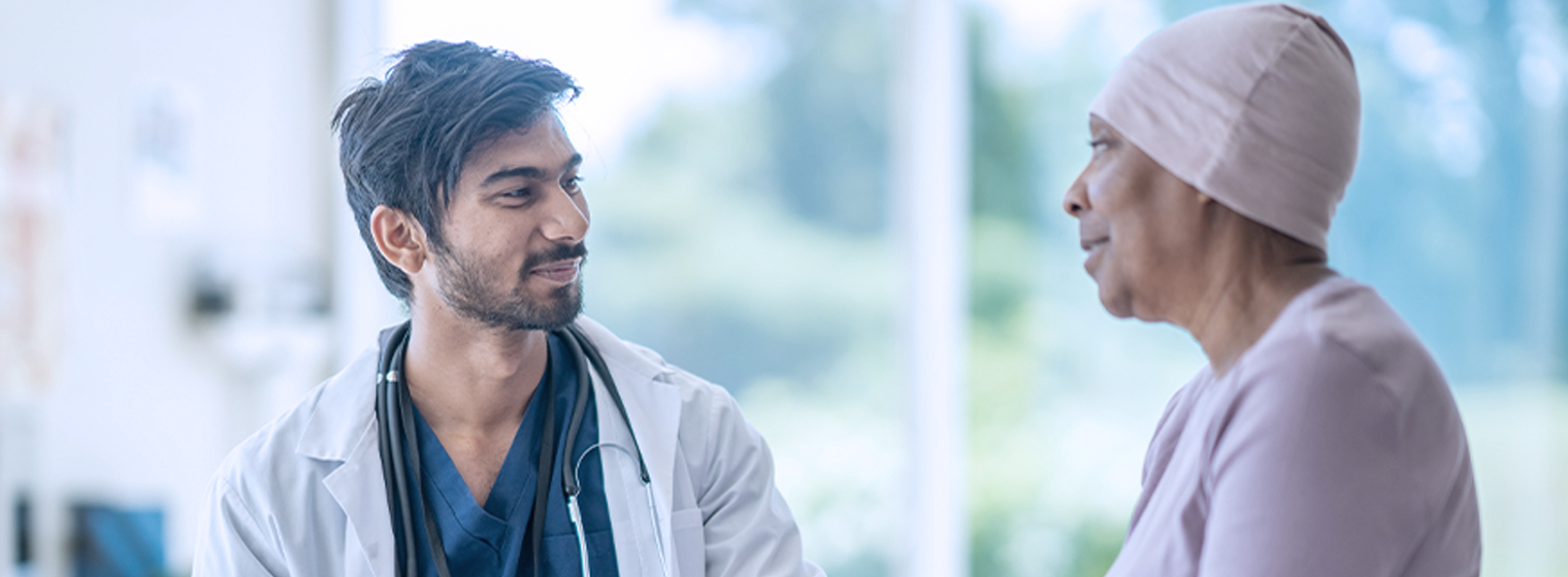 young male doctor talking to a patient