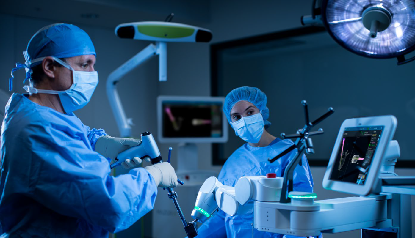 two surgeons in operating room performing a procedure