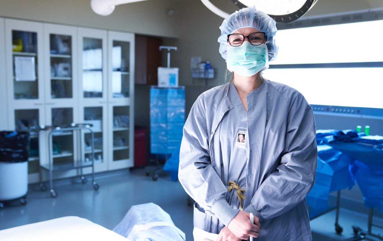 female surgeon in scrubs in operating room