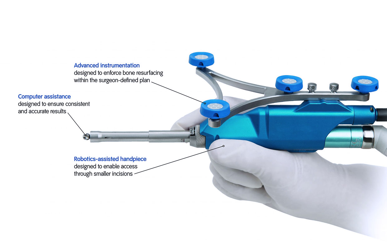 hand demonstrating robotic surgery tool