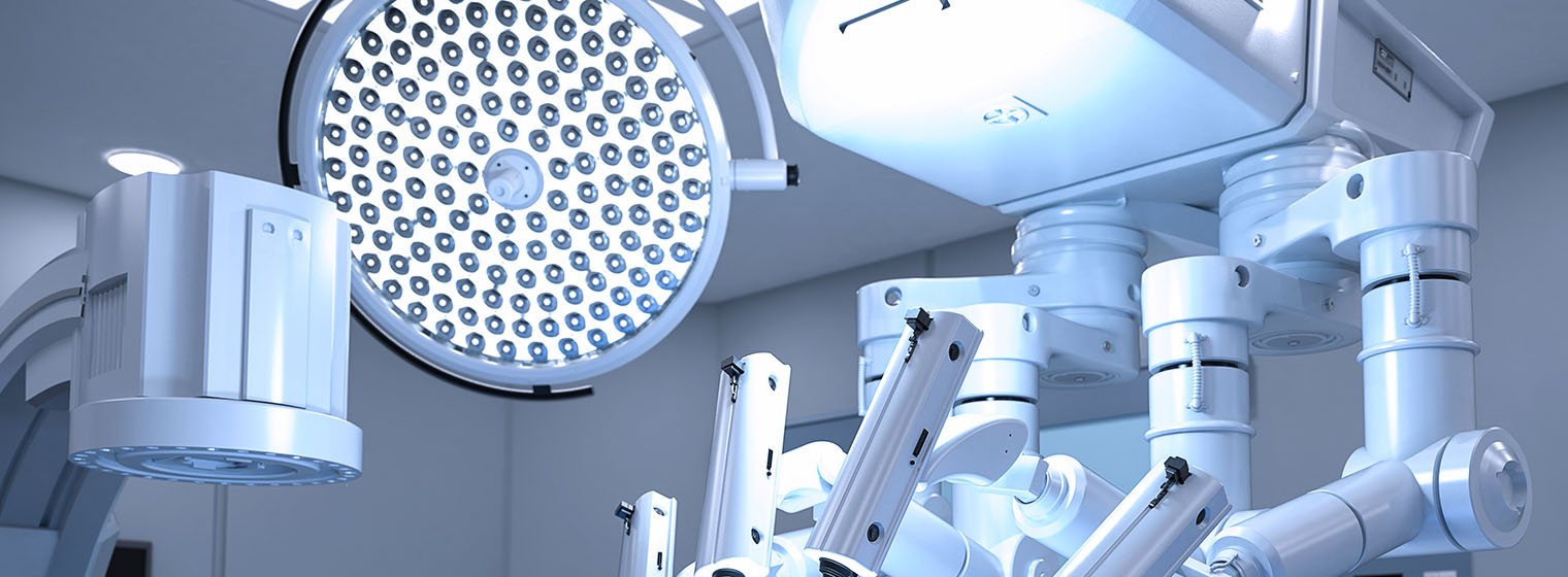 surgical suite with robotic arm for robotic assisted surgery