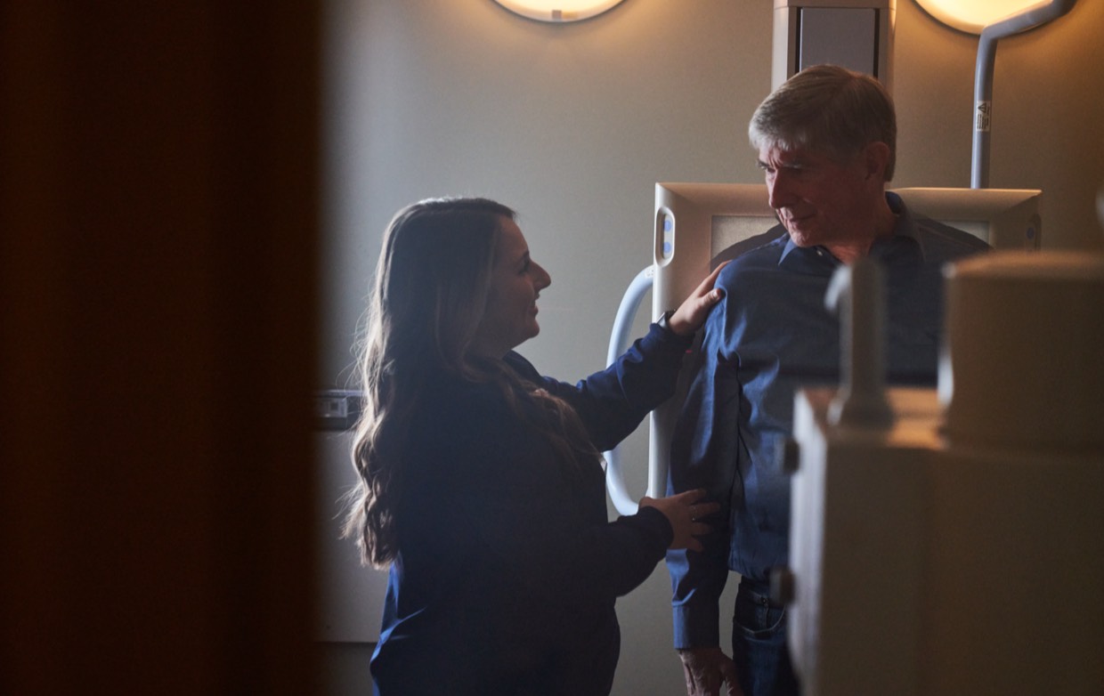 female nurse talks with male patient