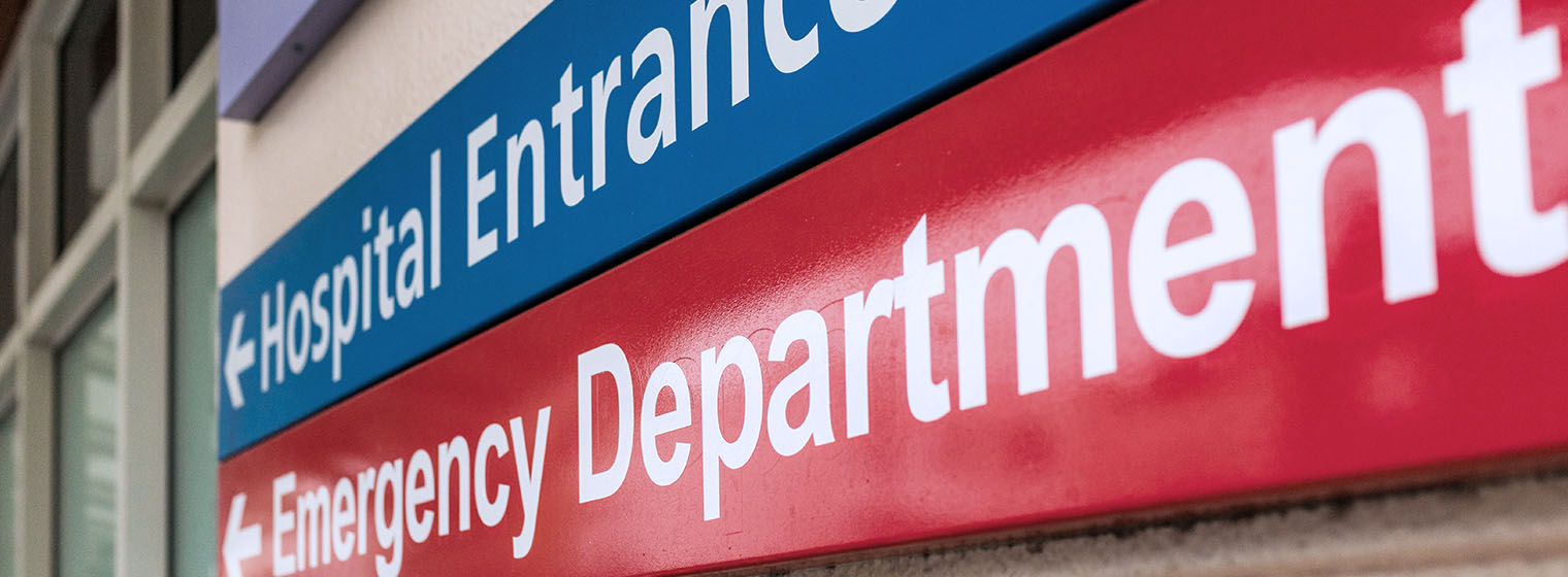 Hospital and emergency department sign entrance.