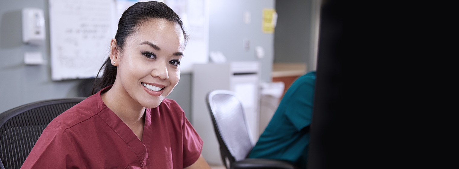 young female medical staff member smiling
