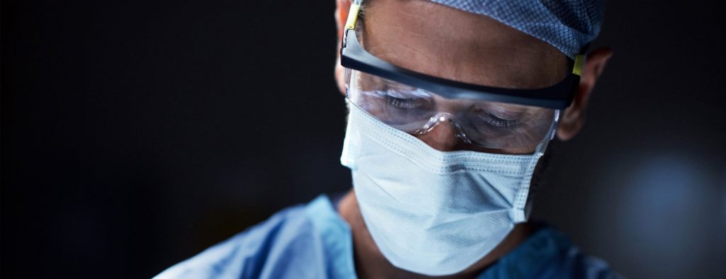 male surgeon with mask