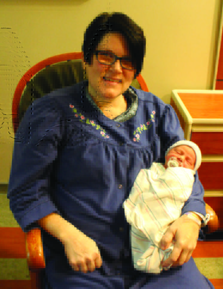 Sharon Jarnigan holds her newborn son Evan at Parkwest’s Childbirth Center.