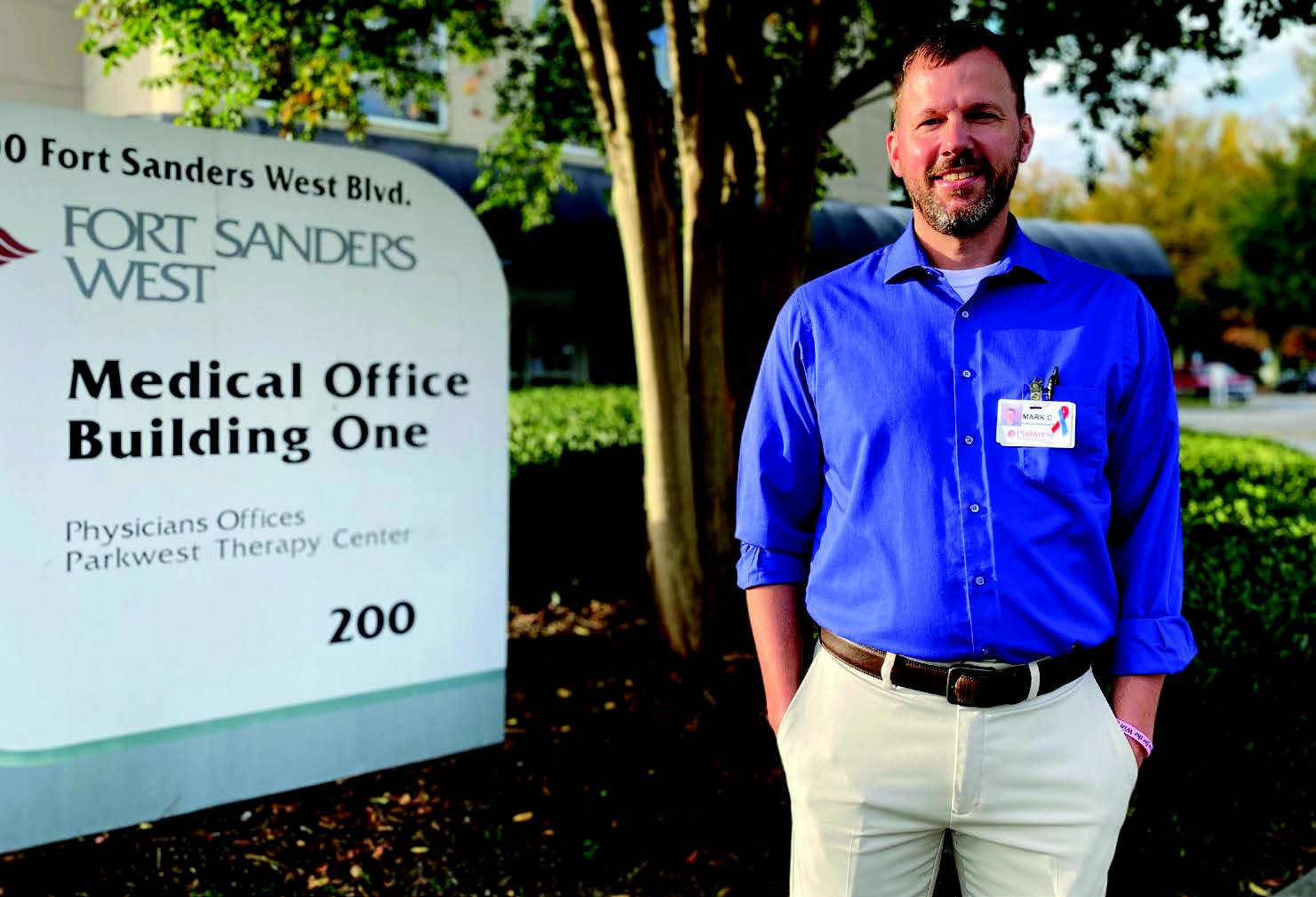 0813-3259 WSSN Mark Conley-Lung Cancer Awareness 11-25-20-V7 Mark Conley standing beside PT sign