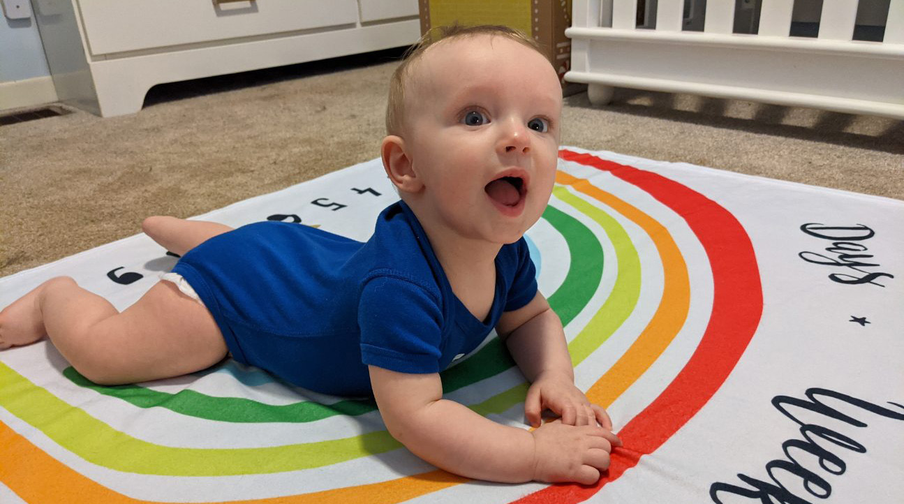 Baby Finley on rainbow mat.
