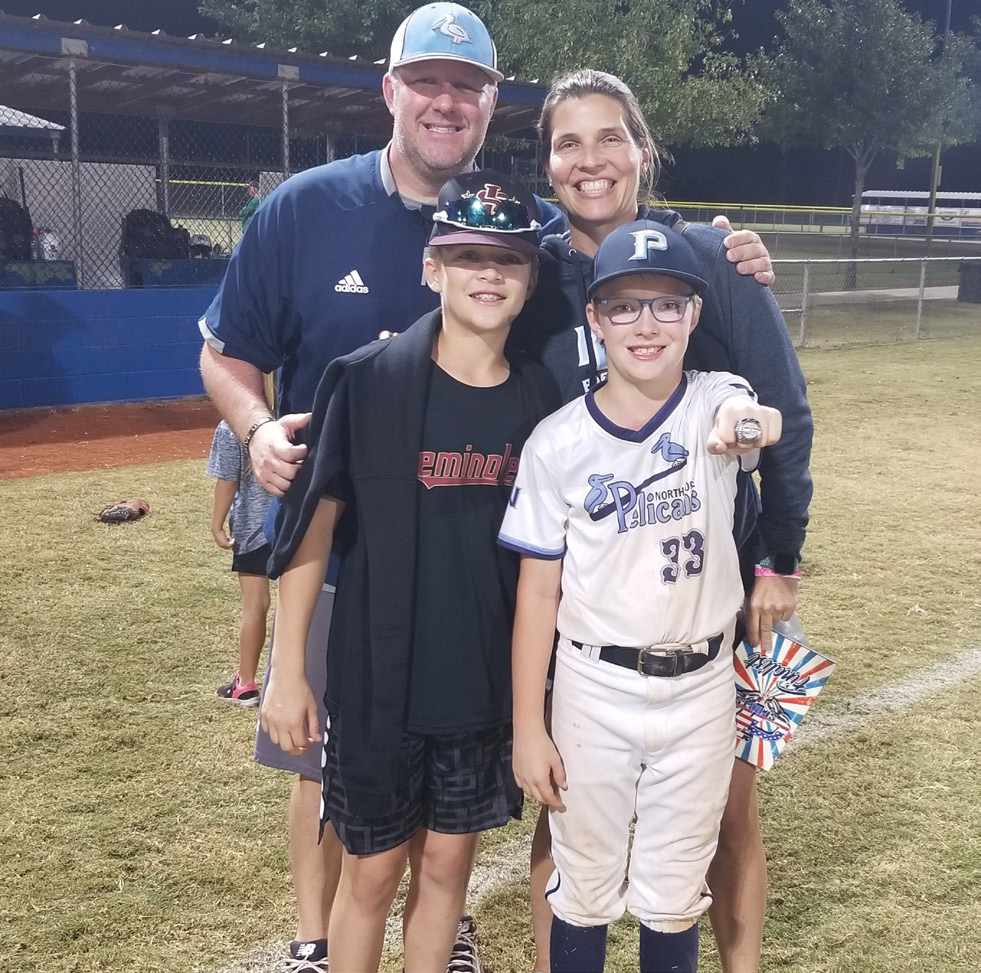 Julie with her family on the baseball field