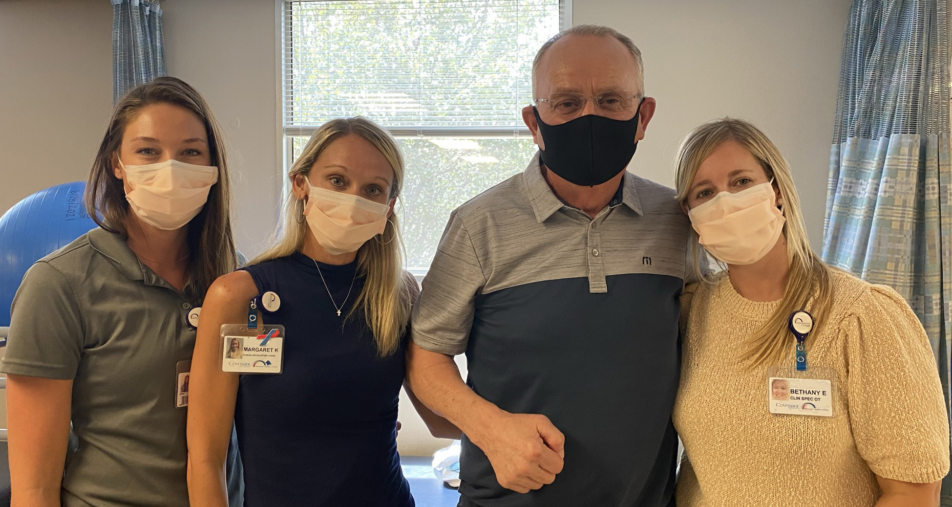 Joe Kemp with his therapy team.