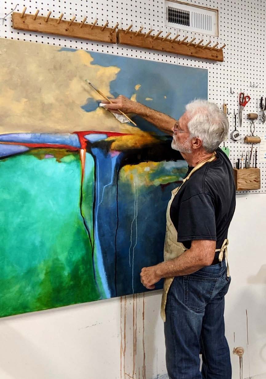 Larry Cole working on painting.