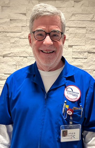 Retired surgeon Lytle Brown in blue volunteer jacket.