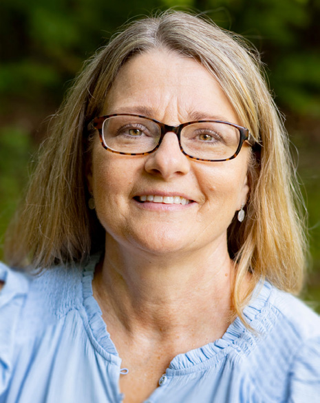 0813-4286 WSSN Survivors Day Run Date 11.9-2 Headshot of Denise Meine-Graham smiling, wearing blue blouse.