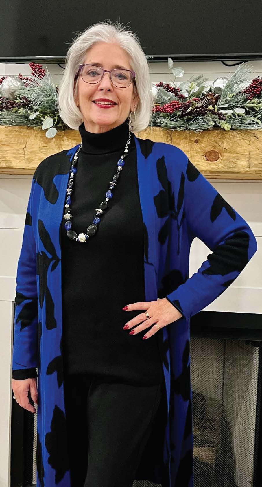 Suzanne Carlyle after surgery wearing blue sweater and black pants.