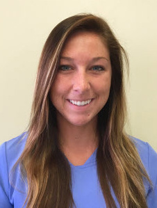 Head shot of Jenna Whipple in periwinkle shirt.