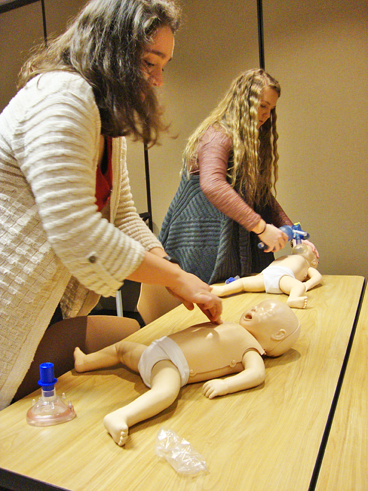 Students learn the infant-specific techniques for CPR.